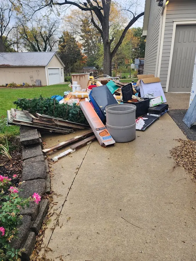 Dumpster being loaded with debris for Residential Dumpster Rental in Lakeland